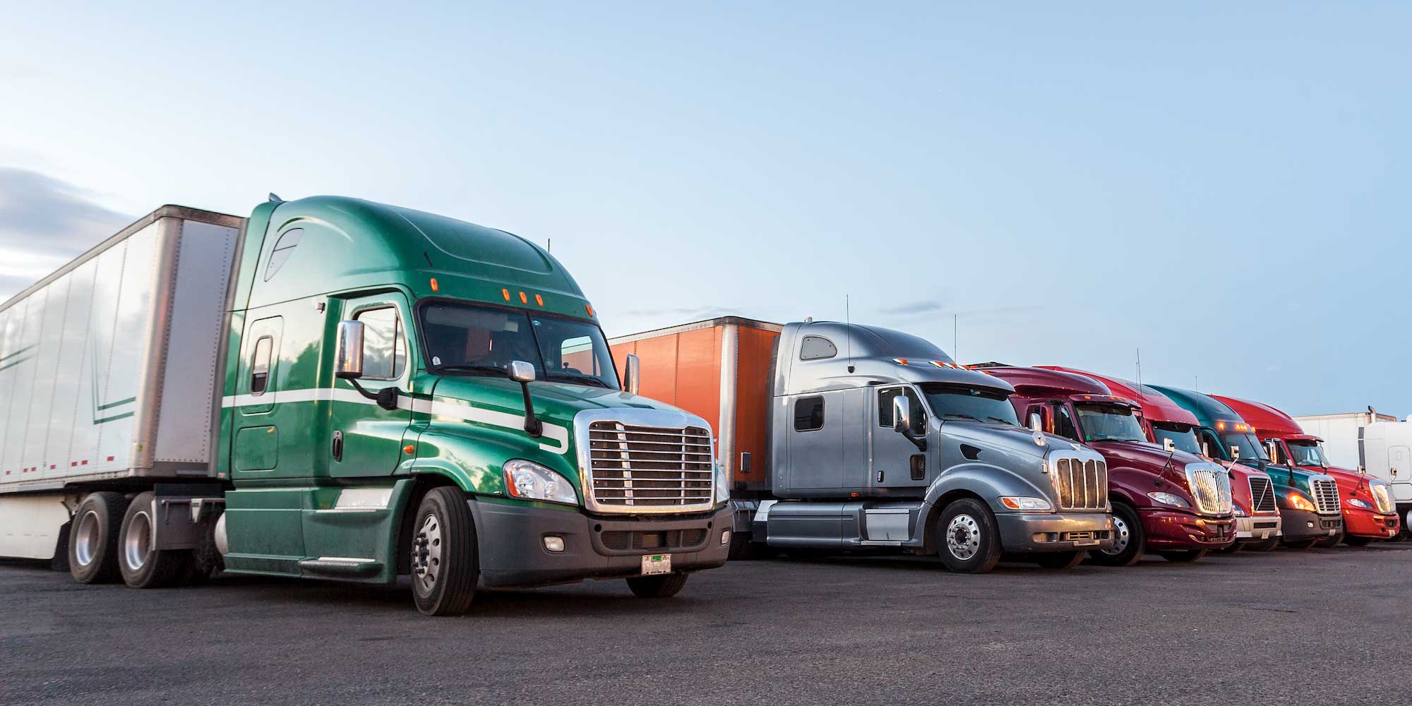 Sleeper trucks parked in a row